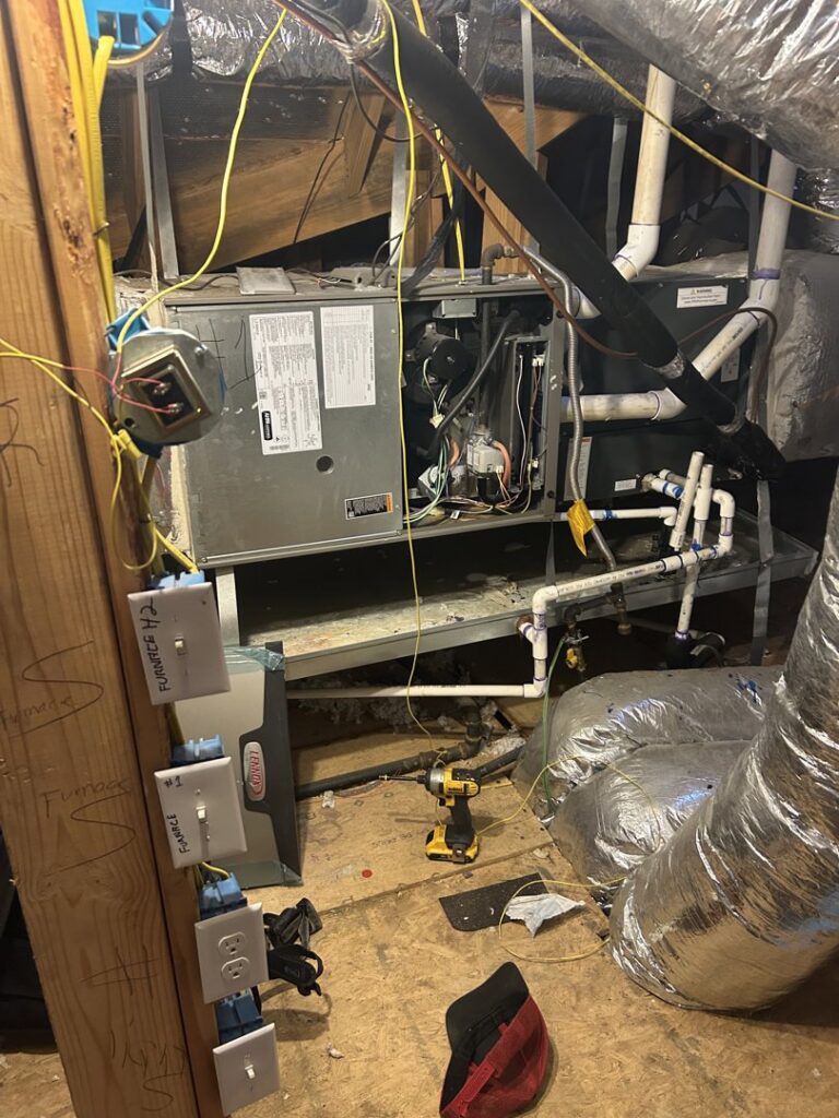 An attic HVAC system undergoing installation or repair with tools by Sonnyreena Mechanical LLC in Garland, TX