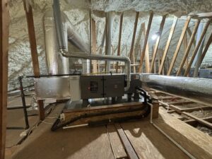 Attic HVAC system with air handler and ductwork surrounded by insulation by ACE Heating & Cooling, Inc. in Jonesboro, AR