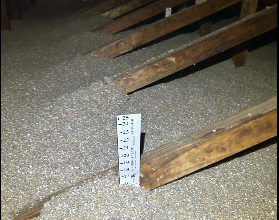 Attic insulation depth being measured after installation by Assured Energy Solutions in Frankfort, IL.