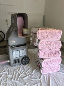 Blown-in attic insulation being installed by Tek-Aire Services Inc. to improve energy efficiency in Columbia, SC.