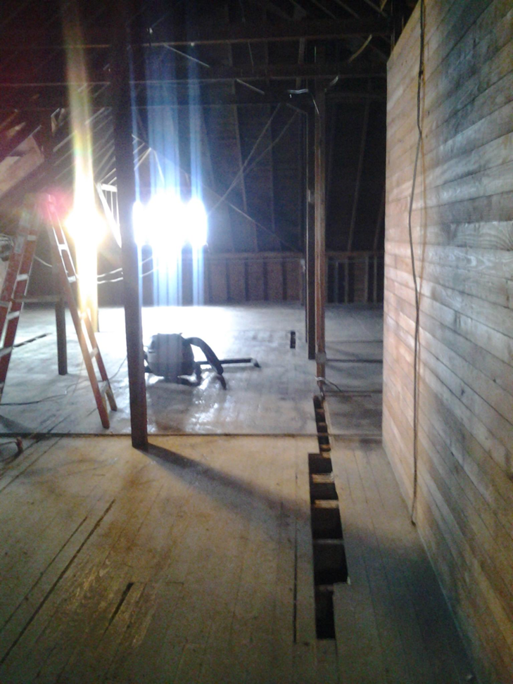 Insulation removal equipment in an attic during a wildlife remediation job by Honeyman's Wildlife Removal in Canastota, NY.