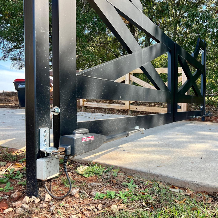 A close-up of an automated gate opener installation by Georgia Entry Solutions in Atlanta, GA.