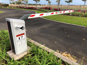 An installed automatic barrier gate for vehicle access control by Allied Security Fence in Kapolei, HI