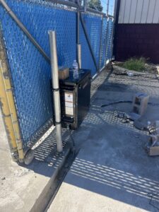 An automatic gate opener mechanism installed by Ace Electrical Services LLC, indicating electrical wiring services in Owensboro, KY.