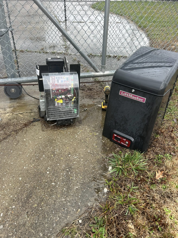 Automatic gate opener installation for a chain link fence by Rager Fencing & Lawn Care, LLC in Owensboro, KY.