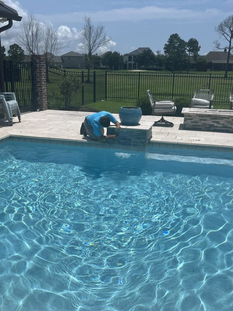 An automatic pool cleaner operating in a clean swimming pool, provided by Gayle Force Pools in Lake Charles, LA