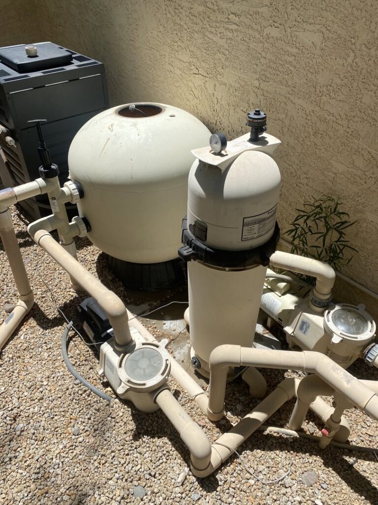 An automatic pool cleaner actively cleaning the bottom of a residential pool for BEHR POOLS Service & Repairs in Glendale, AZ