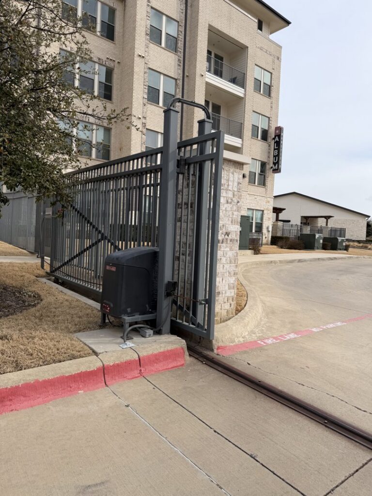 An automatic security gate and its motor mechanism installed by A1 Security Gate & Intercom in Dallas, TX