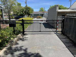 An automatic swing gate installation by Prestige Fencing LLC, providing security in Medford, OR.