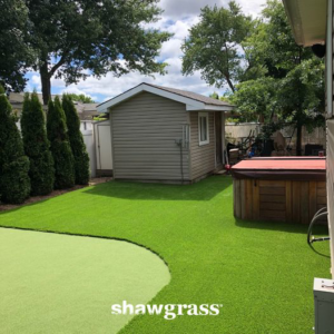 A backyard featuring artificial turf and a dedicated putting green installed by Jabara's Turf Outlet in Wichita, KS.