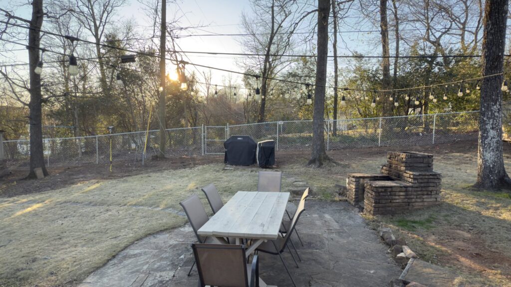 A chain link fence enclosing a backyard area, installed by Top Rail Fence Birmingham, AL