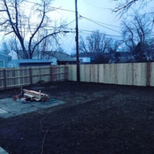 A backyard fence installation project nearing completion by Accent Fence & Design in Lakewood, CO.