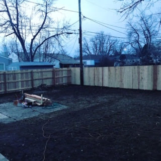 A backyard fence installation project nearing completion by Accent Fence & Design in Lakewood, CO.
