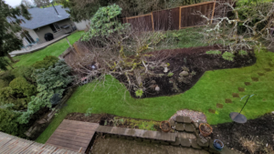 A pristine backyard lawn with perfect stripes, demonstrating expert lawn care from OregonScapes in Eugene, OR.