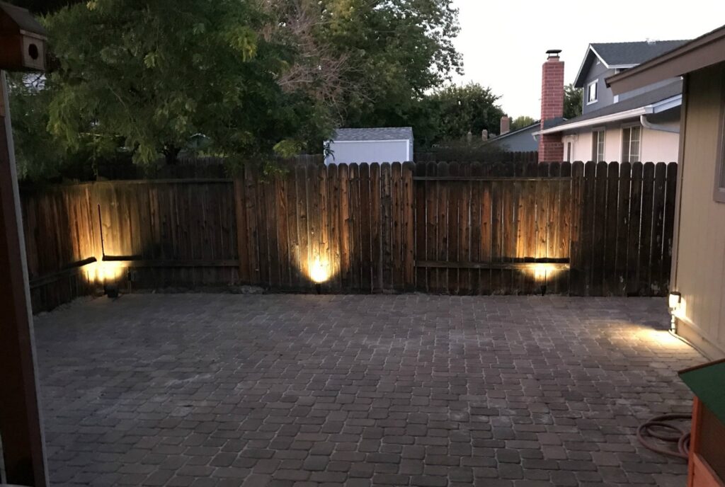Backyard patio with accent lighting installed on the fence by Olectric in Reno, NV.