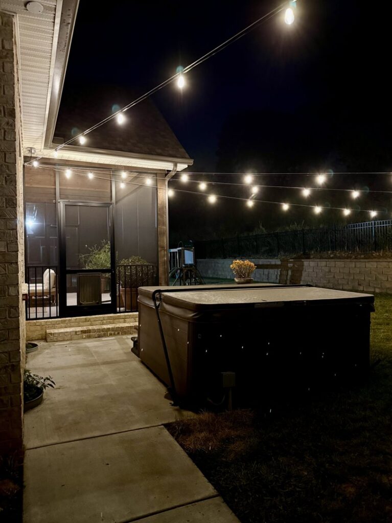 Backyard patio with festive string lights installed by Dr. Sparky in Nashville, TN
