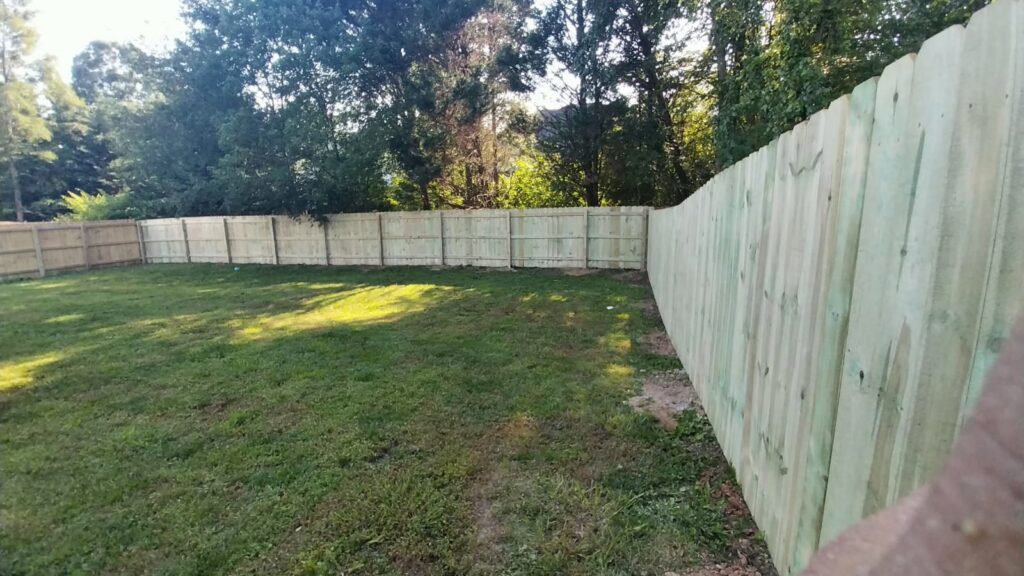 A newly installed backyard wood privacy fence by Escamilla Fence Co. in Knoxville, TN
