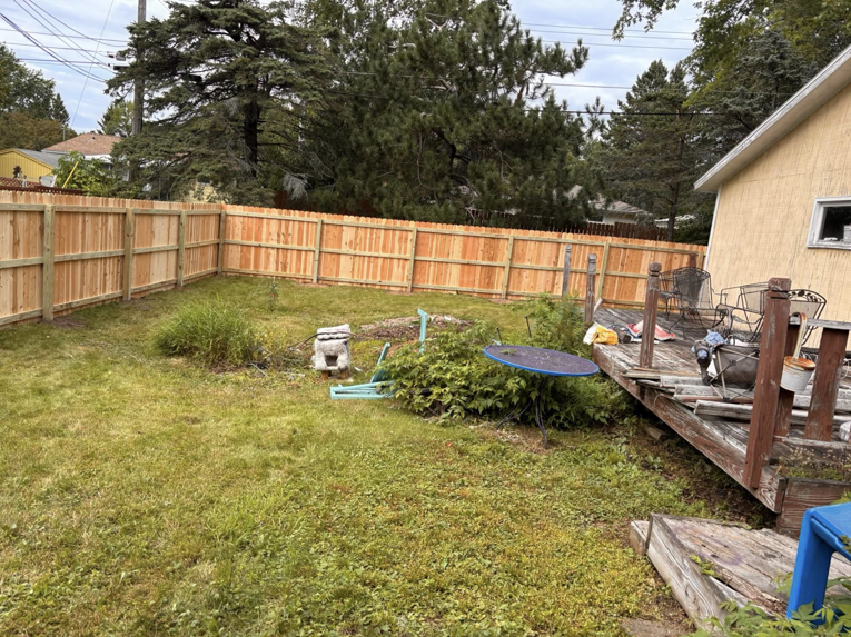 A backyard with a newly installed wood privacy fence by 218 Fencing in Duluth, MN.