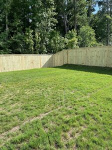 A new wood privacy fence installation in a backyard by 3A Fencing & Landscaping in Atlanta, GA.