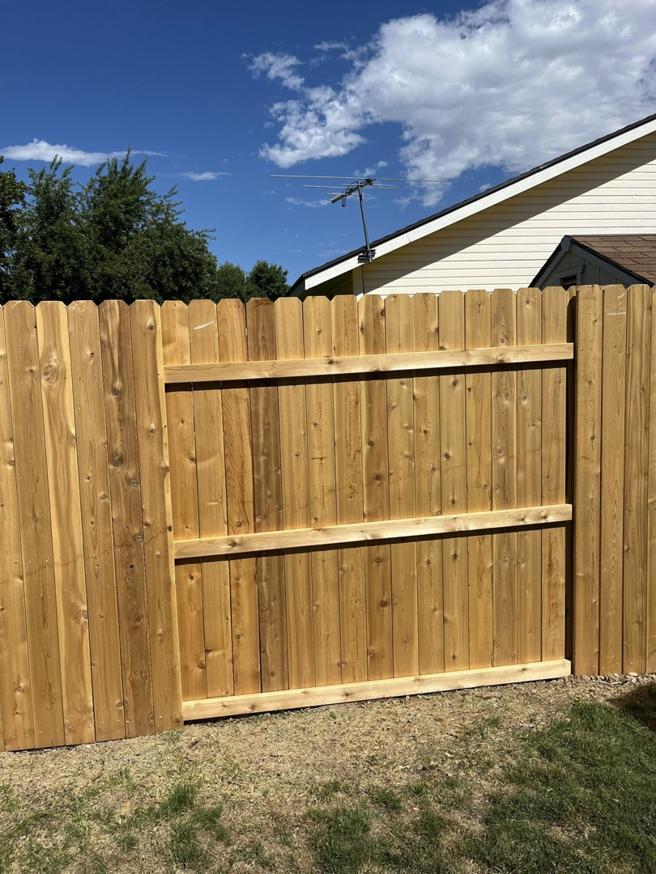 Backyard wood privacy fence panel by Builders choice Fence, Deck & Patio Covers in Nampa, ID