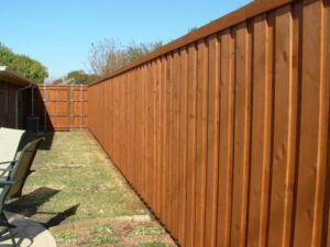 A well-maintained wooden privacy fence enclosing a backyard, installed by Reliable Texas Fencing in Fort Worth, TX.