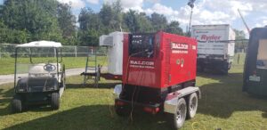 A Baldor generator on a trailer, ready for installation or service by Electricians On Call in Fort Lauderdale, FL.
