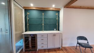Custom bar area with under-shelf lighting and wine fridge installed by AVA Electric, LLC in Fort Worth, TX.