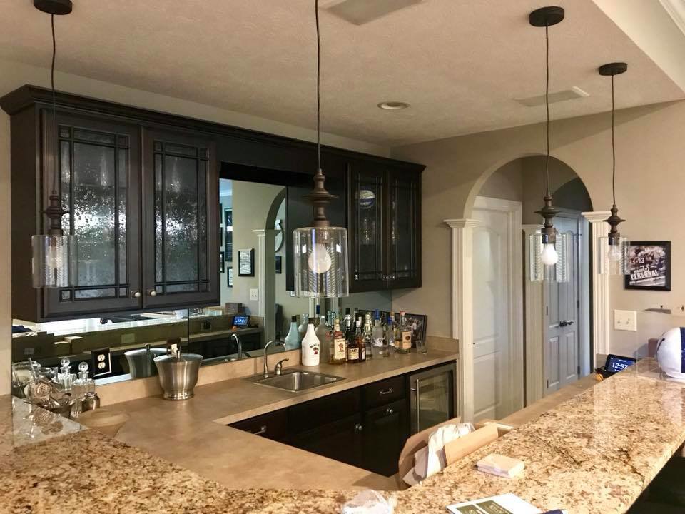 Stylish pendant lights installed over a home bar area by TGR Electric LLC, enhancing ambiance in Carmel, IN.