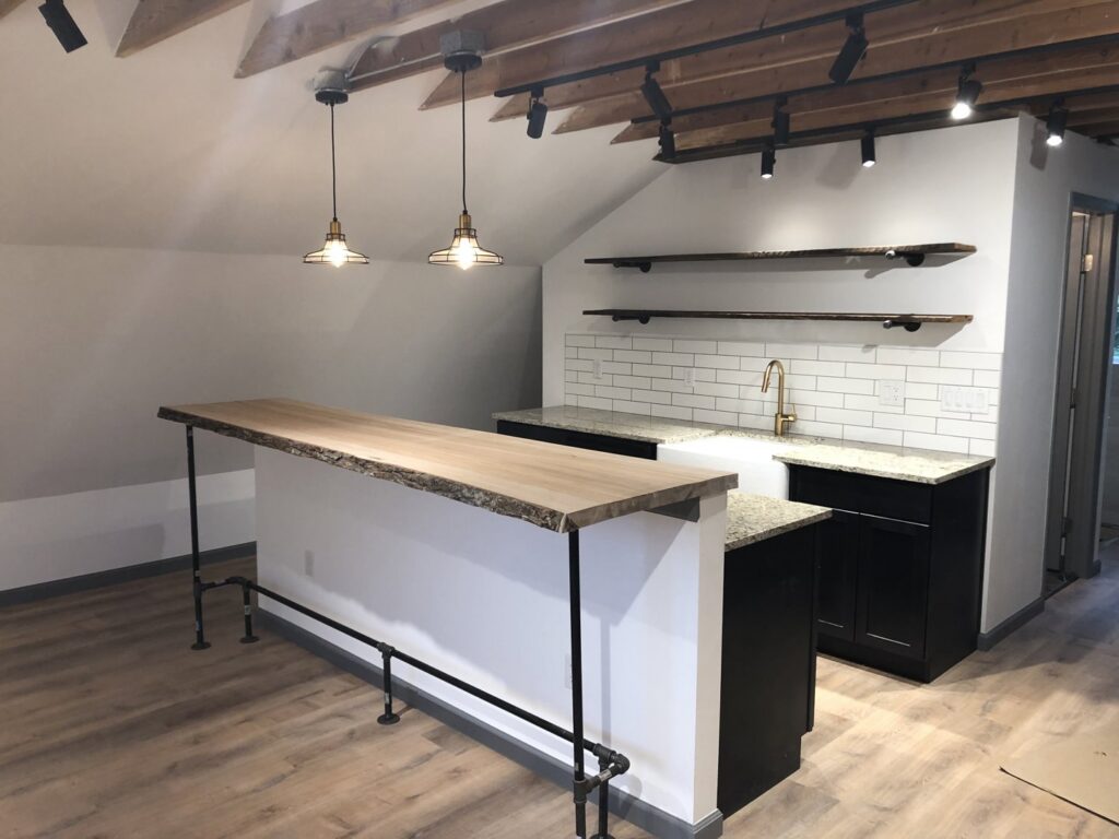 Bar area featuring stylish pendant and track lighting installed by Access Electrical in Indianapolis, IN.
