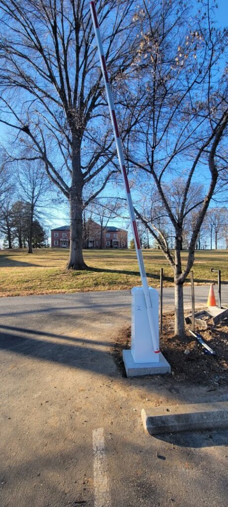 A newly installed barrier arm gate by Universal Overhead And Garage Doors in Baltimore, MD.