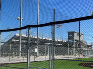 A chain-link fence installed around a baseball field by Statewide Fencing, Inc. in Franksville, WI