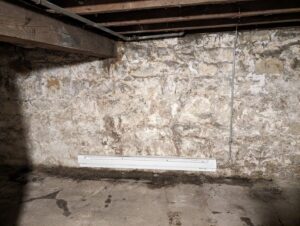 An electric baseboard heater installed in a basement by Be Bright Electric in Erie, PA.