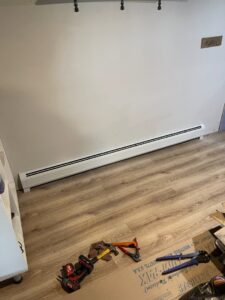 A newly installed baseboard heating unit in a room by MAC Heating and Cooling LLC in Waterbury, CT.