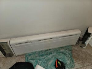 A baseboard heating unit, indicating heating system service by HVAC Royal Service Inc in Chicago, IL.