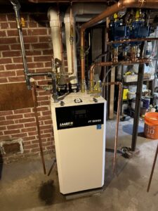A new boiler or furnace unit with copper piping installed by Comfort Systems and Solutions in Coventry, RI