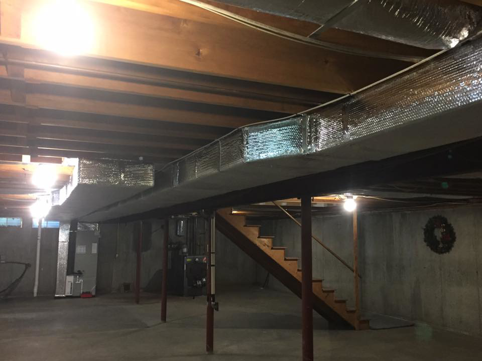 Insulated ductwork and a furnace unit installed in a basement by R&M Mechanical Services LLC in Londonderry, NH