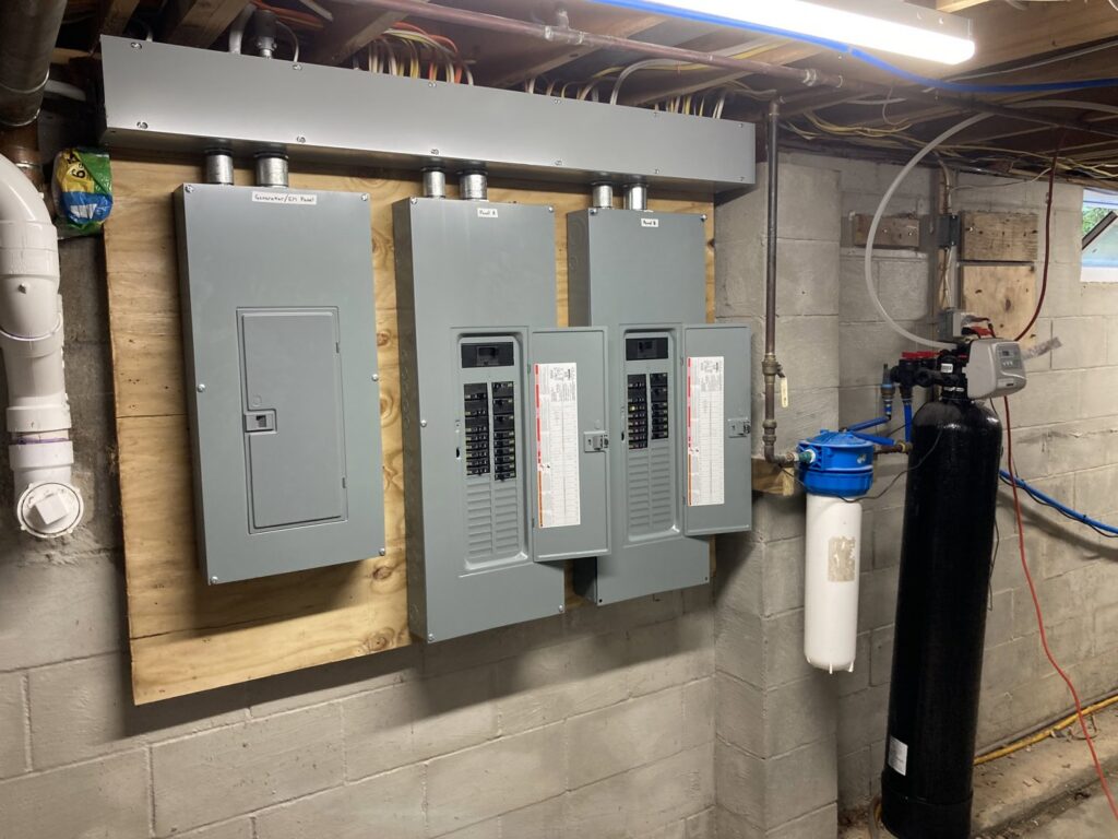 Basement electrical panel installation on a wooden backboard by Patriot Electric L.L.C in Phoenix, AZ