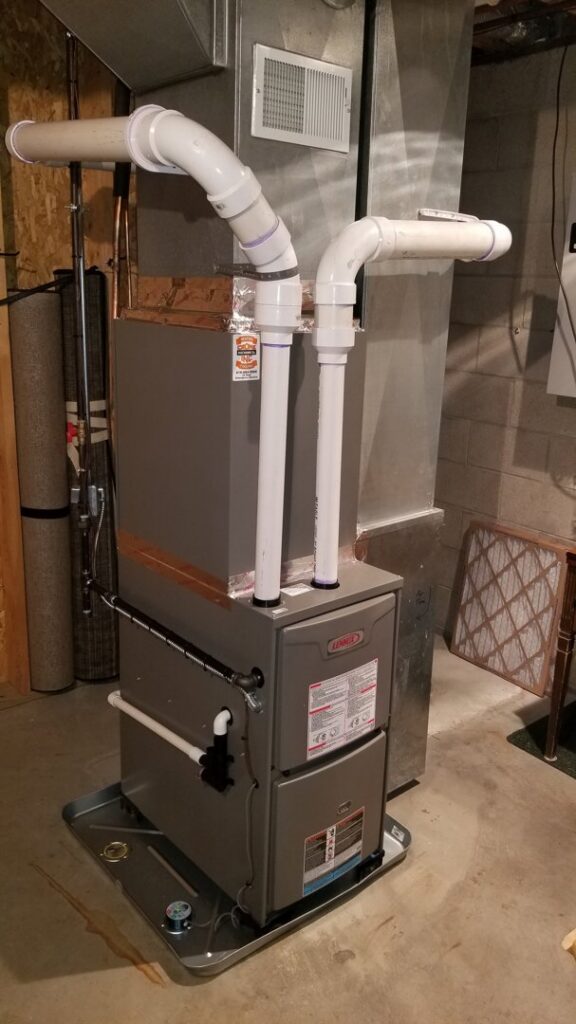 A new Lennox furnace and ductwork installed in a basement by Crome Mechanical Inc. in Cedar Springs, MI