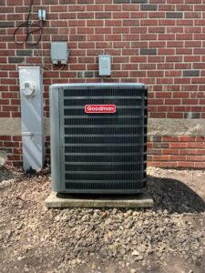 A new Goodman furnace installation in a basement by DJ's Heating & Air Conditioning in Wilmington, IL.