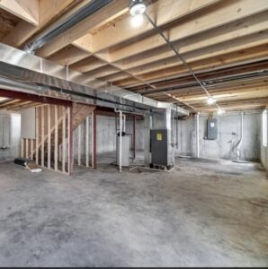 HVAC ductwork and furnace installation in a basement by DJ's Heating & Air Conditioning in Wilmington, IL.