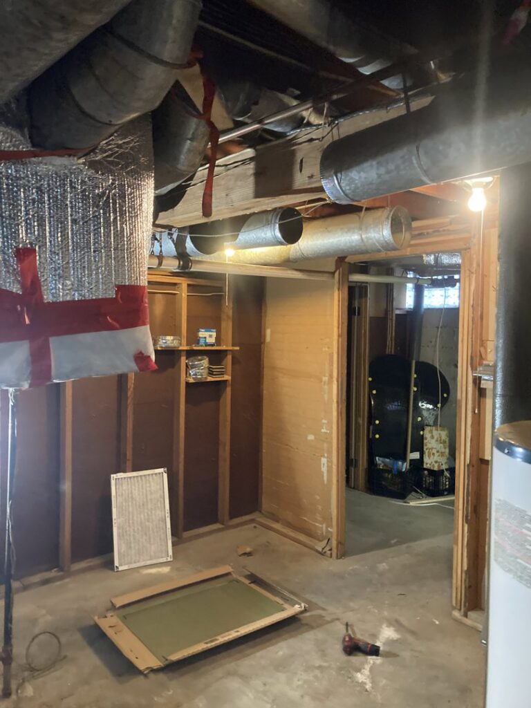 Basement area showing existing HVAC ductwork as part of a system serviced by Manny Services in Syracuse, NY.