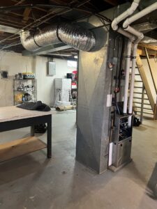 A basement HVAC furnace and ductwork installation by Synergy3, an HVAC contractor in Philadelphia, PA.