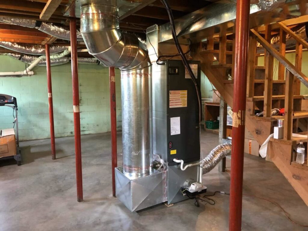 A complete basement HVAC system installation with furnace and ductwork by ReDesign Air in Winchester, VA.