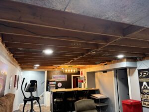 Decorative lighting fixture and exposed wiring in a basement bar area by Sterling Electric in Fort Wayne, IN.