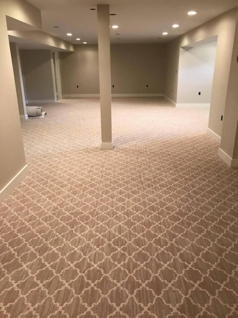 A large basement room with new patterned carpet installed by Carpet King and Flooring in Myrtle Beach, SC.