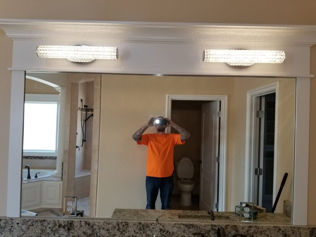 Modern bathroom mirror lighting and electrical outlets installed by Fiedler Electric in Higginsville, MO.