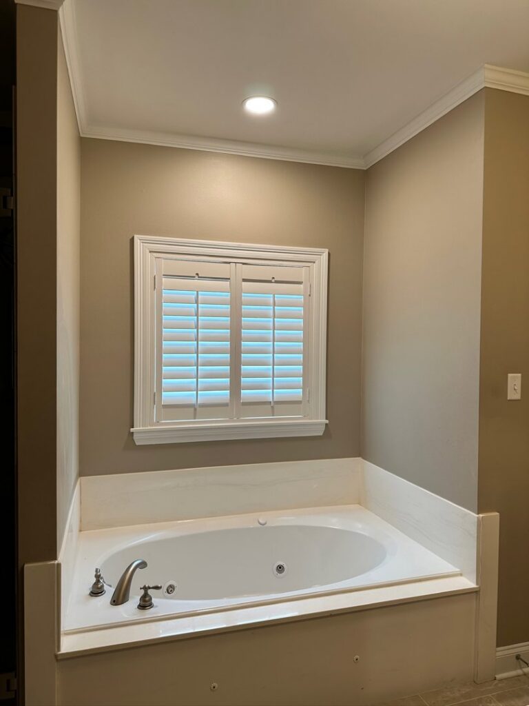 A recessed light installed above a bathtub in a bathroom by LiveWire Electrical Services, LLC. in Houma, LA.