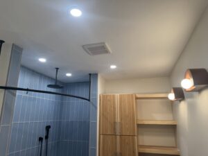 Modern bathroom with newly installed recessed lighting and exhaust fan by Rudis Electrical LLC in Scranton, PA.