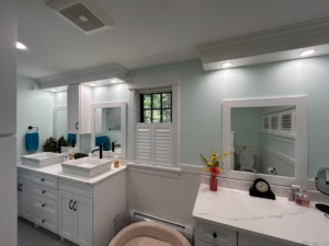 Modern recessed and vanity lighting installed in a bathroom by Nuts And Volts Electric LLC in Farmington, NH.