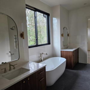 Elegant wall-mounted sconce light fixtures installed in a spacious bathroom by Jam Electric in Albuquerque, NM.